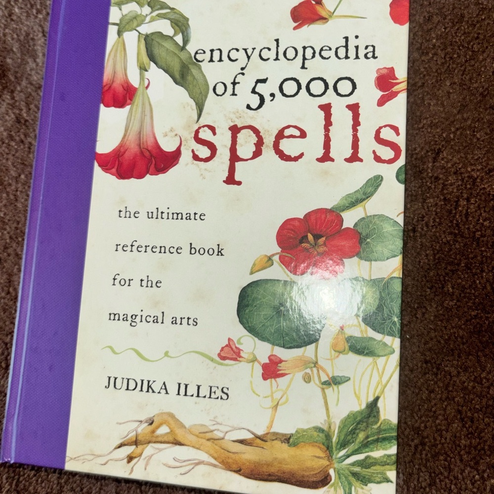 Encyclopedia of 5,000 Spells by Judika Illes - White & Purple Cover